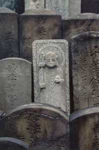 Stone Buddah in grave yard